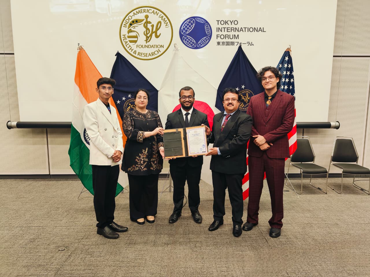Jabez David John receiving the Tokyo Gold Honours award at the Tokyo International Forum, Indo-American Health Research